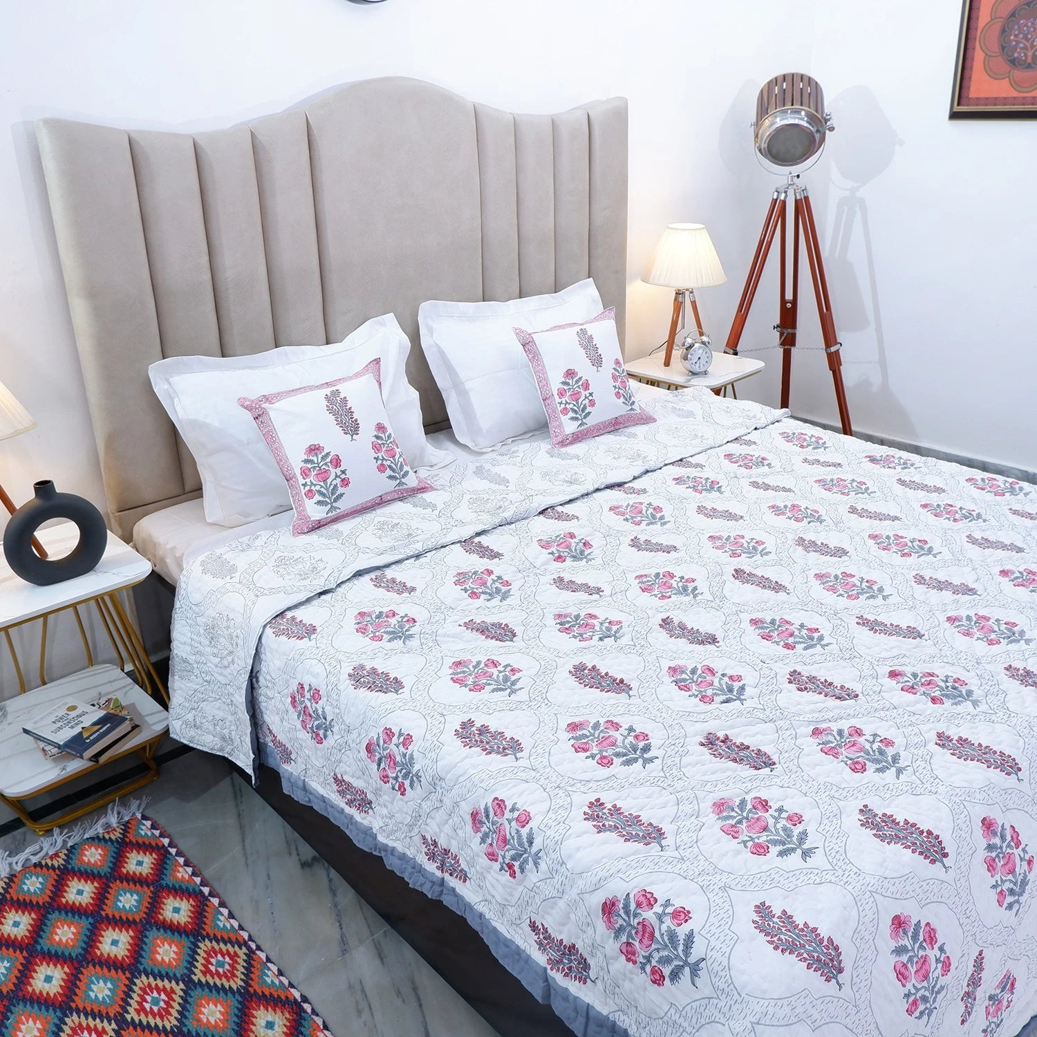 Elegant handcrafted Jaipur quilts for bedroom featuring floral patterns and a soft color palette